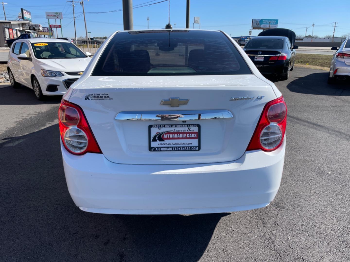 2016 White Chevrolet Sonic (1G1JC5SHXG4) with an 4-Cyl, 1.8 Liter engine, Automatic, 6-Spd transmission, located at 8008 Warden Rd, Sherwood, AR, 72120, (501) 801-6100, 34.830078, -92.186684 - Photo#6